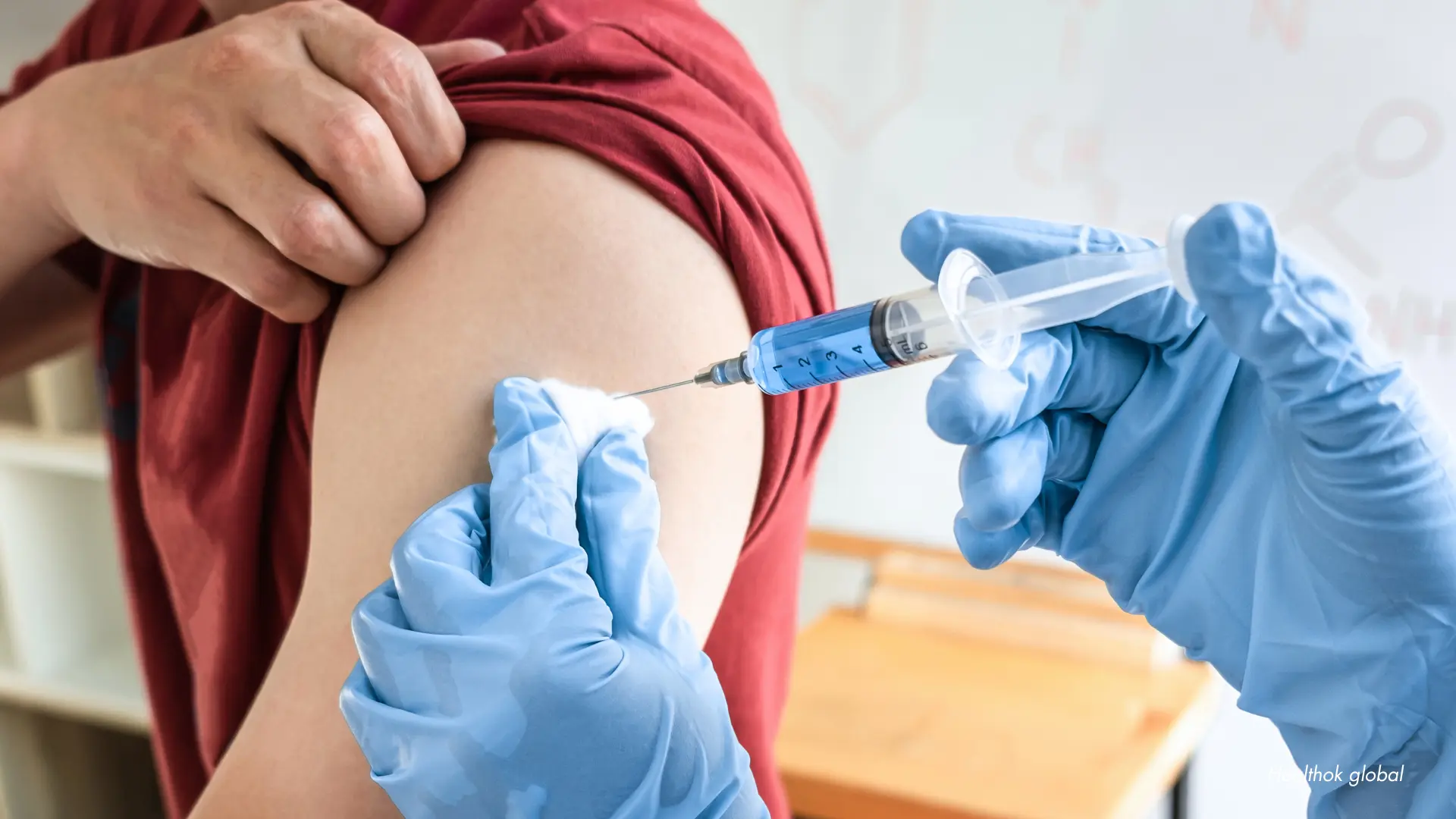 A doctor explaining the HPV vaccine schedule and benefits to a patient in India.